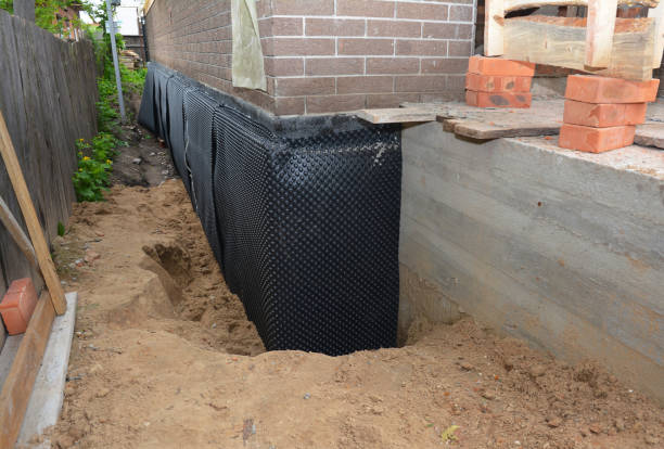 SJ Waterproofing Pros technician performing targeted Sump Pump Installation assessment in Northbrook, IL